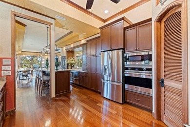 Commanding a premier position at the point of Bayou Grande, this