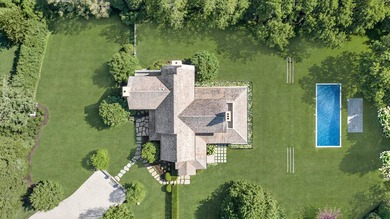 Down a long gated driveway on a secluded and beautifully - photo 50
