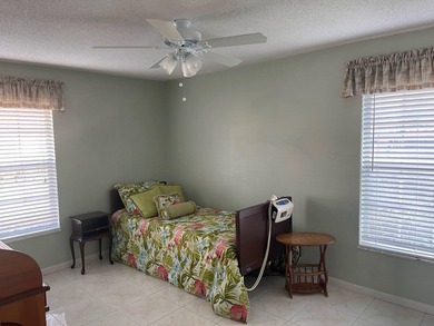 Welcome to this desirable 55+ community End-unit villa in the - photo 12