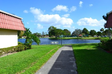 Welcome to this desirable 55+ community End-unit villa in the - photo 13