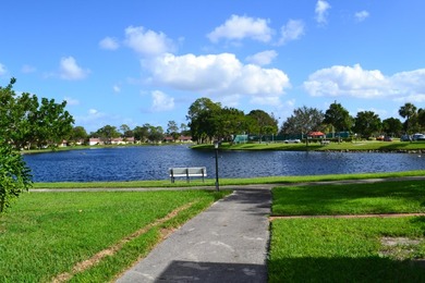 Welcome to this desirable 55+ community End-unit villa in the - photo 14