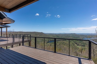 Perched high above Lake Toxaway, this exquisite new-construction - photo 9