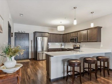 Better than new and truly move-in ready. This bright, airy condo