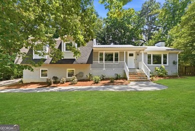 Welcome home to this beautifully renovated 3-bedroom, 2-bathroom - photo 1