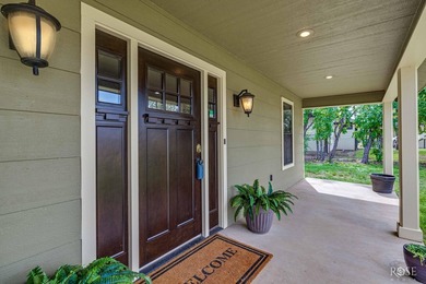 Nestled on an owned lot along the shores of Lake Nasworthy, this - photo 2