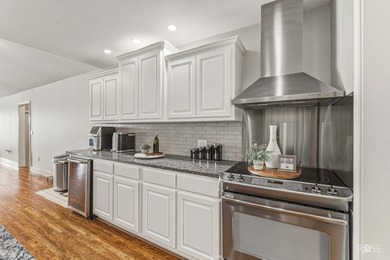 Nestled on an owned lot along the shores of Lake Nasworthy, this - photo 8