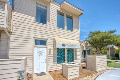 Located in the heart of Harbourtown in Gulf Breeze Proper, this - photo 1