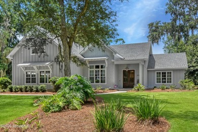 Tucked into a coveted corner of St Simons Island, this - photo 1