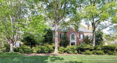 An exquisite home nestled on a double homesite bordering a - photo 1