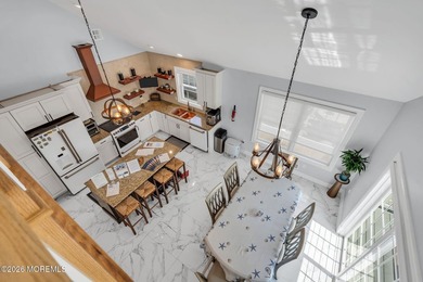 Custom-built in 2023 with water views, this meticulously - photo 12