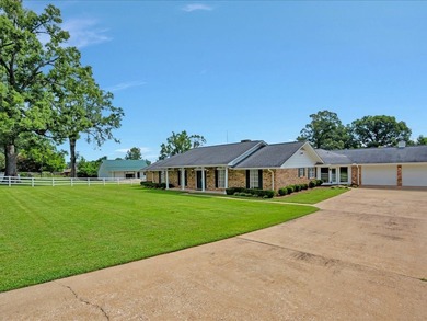 This well maintained home is situated on 13.86 acres.  Inside