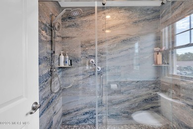 Custom-built in 2023 with water views, this meticulously - photo 32