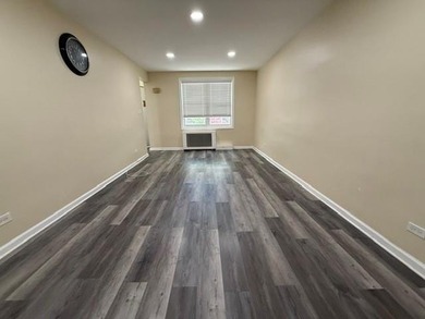 Well-maintained two-family brick home located in the highly - photo 3