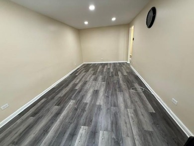 Well-maintained two-family brick home located in the highly - photo 4