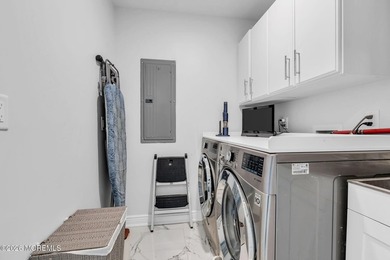 Custom-built in 2023 with water views, this meticulously - photo 34