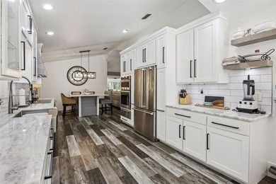 Welcome to elevated lake living, nestled within the sought-after - photo 11