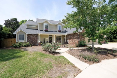 Lovely four-bedroom home situated on a spacious lot in the - photo 1
