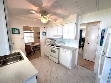 This beautifully maintained turnkey furnished home is situated - photo 6