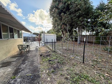 Opportunity awaits in this solid CBS construction home in the - photo 2