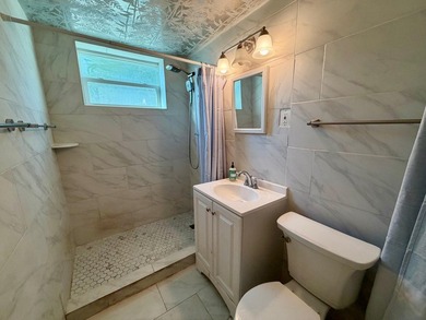 Opportunity awaits in this solid CBS construction home in the - photo 5