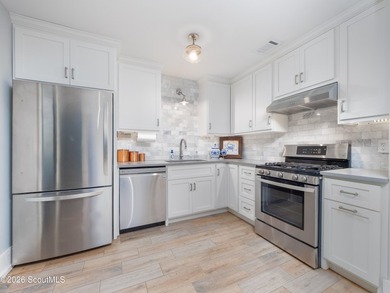 Embrace casual beach town living in this beautifully renovated - photo 6