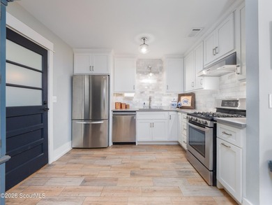 Embrace casual beach town living in this beautifully renovated - photo 7