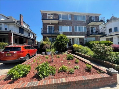Welcome home to this stunning solid-brick three-family residence - photo 1