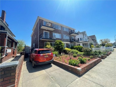 Welcome home to this stunning solid-brick three-family residence - photo 4