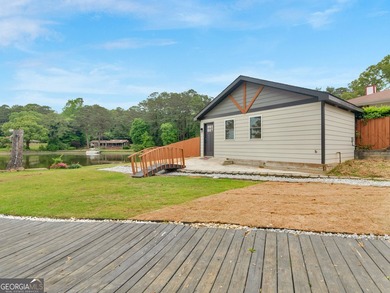 Lakefront Living! Experience serene lakefront living in this - photo 4