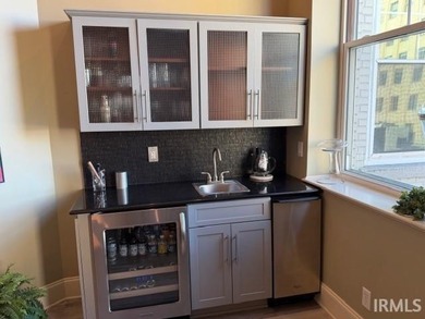 Experience refined urban living in this top-floor corner condo