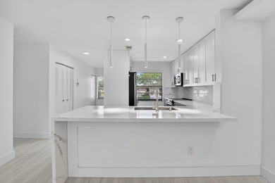 ABSOLUTELY STUNNING FULLY RENOVATED CONDO | BOCA LAGO COMMUNITY - photo 11