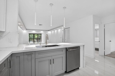ABSOLUTELY STUNNING FULLY RENOVATED CONDO | BOCA LAGO COMMUNITY - photo 13