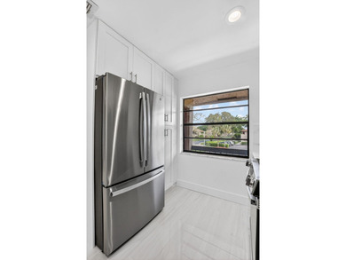 ABSOLUTELY STUNNING FULLY RENOVATED CONDO | BOCA LAGO COMMUNITY - photo 14