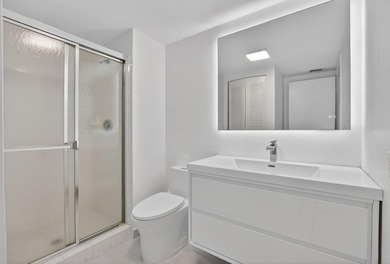 ABSOLUTELY STUNNING FULLY RENOVATED CONDO | BOCA LAGO COMMUNITY - photo 23