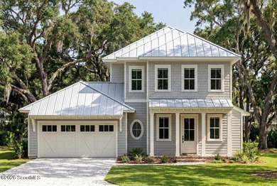 Experience exceptional coastal living in this thoughtfully - photo 1