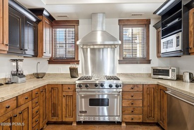 This 3-bedroom, 4-bathroom fully furnished end unit offers - photo 3