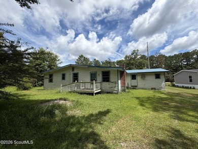 FIXER UPPER. The metal roof appears to be newer, and the - photo 3