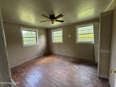 FIXER UPPER. The metal roof appears to be newer, and the - photo 6