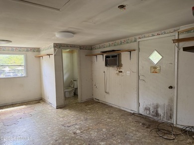 FIXER UPPER. The metal roof appears to be newer, and the - photo 8
