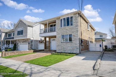 Welcome to this custom-built two-family detached home! This - photo 2