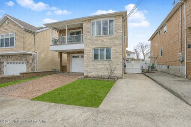 Welcome to this custom-built two-family detached home! This - photo 3