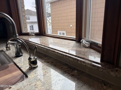 Welcome to this custom-built two-family detached home! This - photo 9
