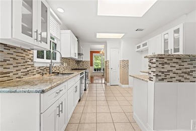 Welcome home to this beautifully maintained brick-front - photo 14