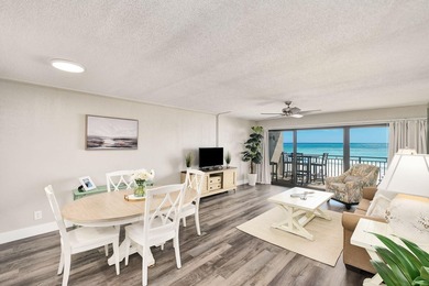 Wake up to stunning Gulf-front views in this charming - photo 1