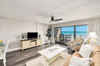 Wake up to stunning Gulf-front views in this charming - photo 4