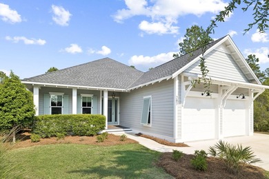 Located in WaterSound Origins, this Ficus plan built by Huff - photo 1