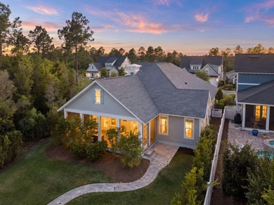 Located in WaterSound Origins, this Ficus plan built by Huff - photo 2