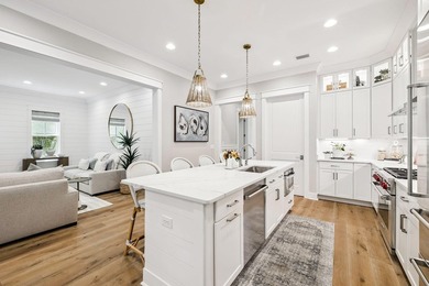Located in WaterSound Origins, this Ficus plan built by Huff - photo 10