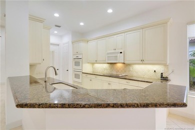 Step into light-filled elegance in this meticulously maintained - photo 17