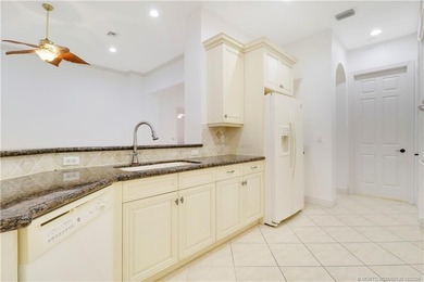 Step into light-filled elegance in this meticulously maintained - photo 18